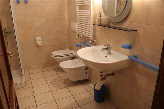 bathroom with shower and washing machine